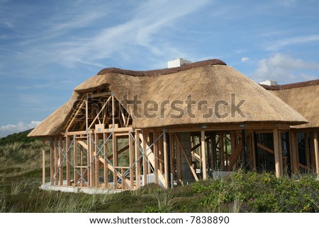 construction of half timbered traditional house   with  thatched traditional  roof