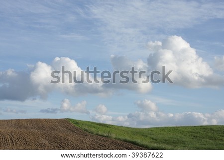 Summer sky with nice cloud formation and  danish country side landscape