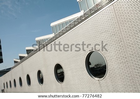 white wall with round window in the summer
