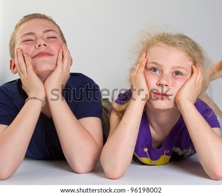 Bored kids with white background; shot in studio