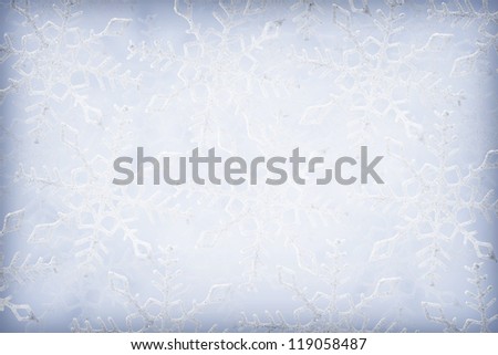 Blue and white snowflakes on a blue and white background