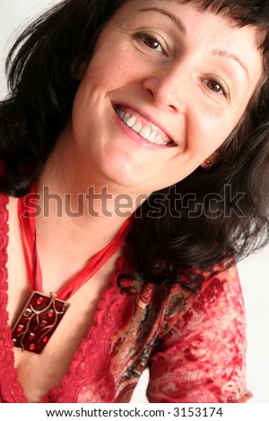 stock photo Portrait of a beautiful brunette mature woman wearing red 