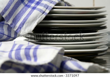 Dishes wiped with white blue checked dishtowel
