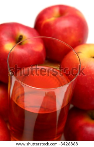 Red apples and apple juice on a white background