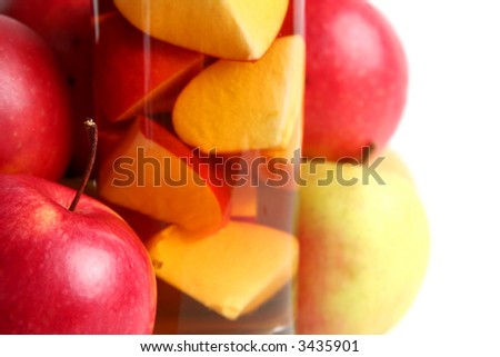 Red apples and apple juice on a white background