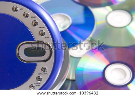 Compact discs and round  blue cd player