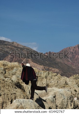 man standing in balance in the moon valley