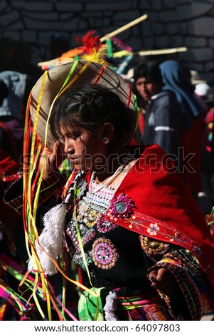 SANTA LUCIA, BOLIVIA - AUG 24: Unidentified Bolivian young woman dancing during San Bartolomeo traditional festivity on August 24, 2010 in Santa Lucia, near Potosi in Bolivia.