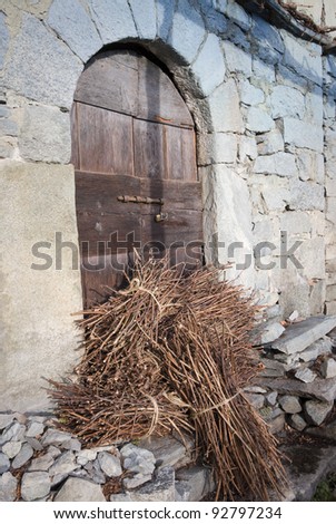 wood in front of a door on the alps
