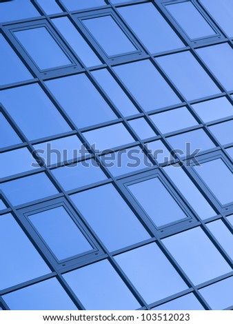 Modern office building with blue square windows.