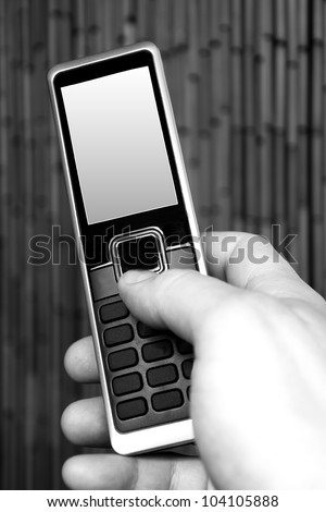 hand holding phone.Black and white photography.