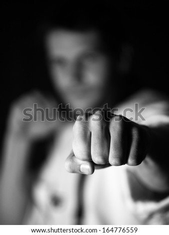 young man trains blow a hand, the washed-away background