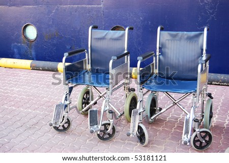 Wheelchairs, standing at the entrance to the ship
