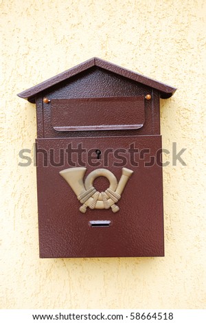 Mail box hanging on a fence wall