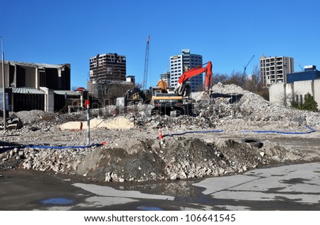 CHRISTCHURCH, NEW ZEALAND - MAY 27: An excavator sits atop a pile of rubble that was before recent earthquakes the iconic Park Royal Hotel in Victoria Street on May 27, 2012 in Christchurch.