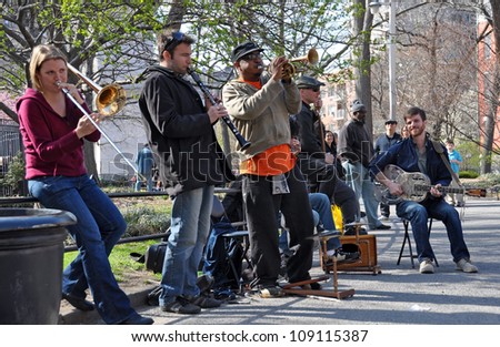 NEW YORK, USA - APRIL 9: Traditional Jazz Band playing dixieland music for the lunch time crowd in Washington Square, Greenwich Village on April 09, 2008 in New York.