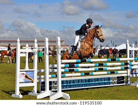 CHRISTCHURCH, NEW ZEALAND - NOVEMBER 16: Woman and horse competing in the show jumping event at The 2012 Canterbury A&P Show on November 16, 2012 in Christchurch.