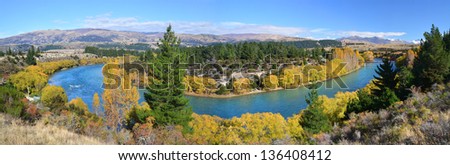 Panoramic view of the Clutha River and Bridge in Autumn. One of New Zealand's longest and most beautiful rivers and popular for trout fishing.