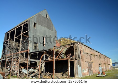 CHRISTCHURCH, NEW ZEALAND - JUNE 29, 2013:  Wood\'s Flour Mill, one of the oldest buildings in Addington, awaits renovation three years after  devastating earthquakes on June 29, 2013 in Christchurch.