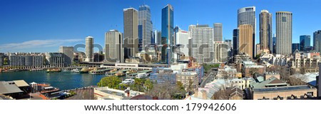 SYDNEY, AUSTRALIA - JULY 03, 2011:  Panoramic view of Sydney city and skyline with Circular Quay in the left foreground and the historic Rocks area at the right.