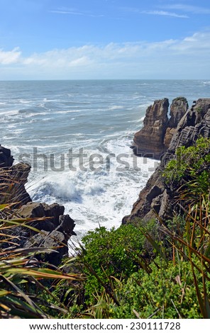 Massive waves crashing on the rocks at Punakaiki, Looking north up the West Coast towards Karamea, New Zealand