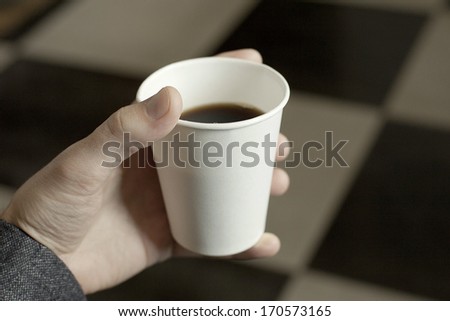 cup of coffee in hand