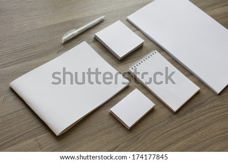 Blank stationery set on wood background / a4 paper, business cards, letterheads, booklet, notepad and pen