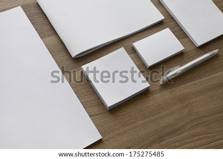 Blank stationery set on wood background / a4 paper, business cards, booklet, notepad and etc