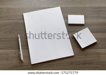 Blank stationery set on wood background / a4 paper, business cards, booklet, sheets and pen