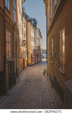 View a narrow street in the Old Town. Stockholm, Sweden. Retro film effect.