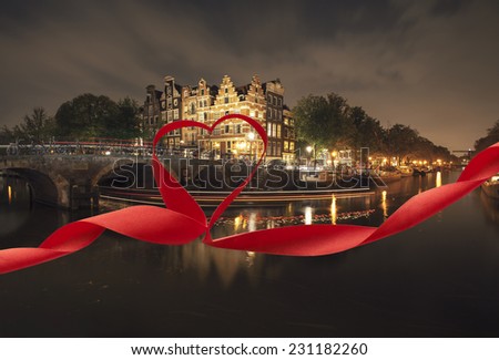 Romantic night view of Amsterdam, with red ribbon and heart