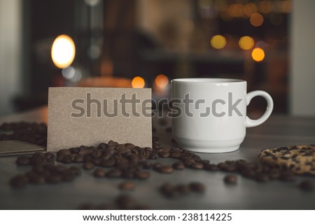Photo a cup of coffee and blank business card for the application logo