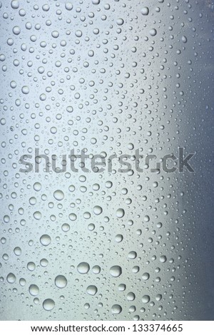 condensation and drops on a glass with touches of color
