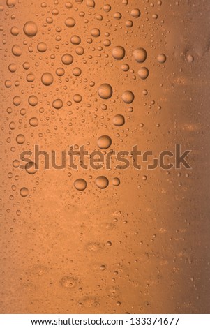 condensation and drops on a glass with touches of color