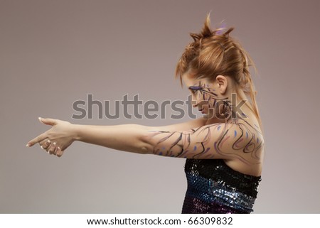 Side view of a Female model pointing. Gun shaped hands