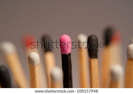 black und white Matches with a pink one in the middle