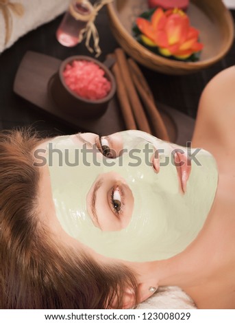 Portrait of a woman with spa mask on her face