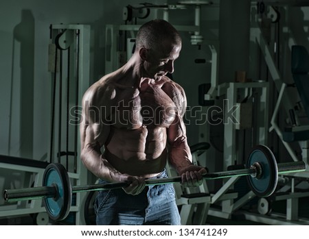 Muscular Man Doing Heavy Barbell Exercise