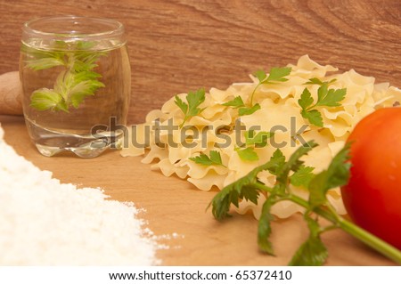 Pasta on an old wooden table in a dark old kitchen service
