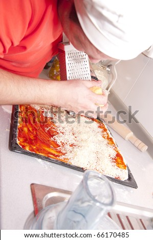 Chef preparing pizza photographed the strange angle