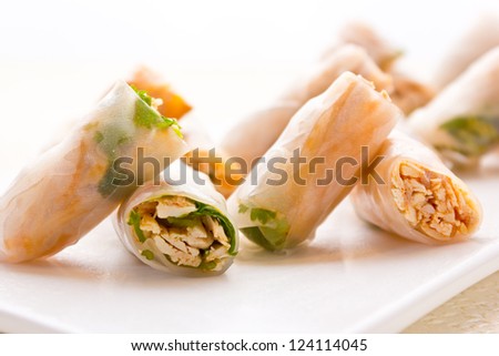 Several hand rolled temaki style sushi rolls filled with vegetables