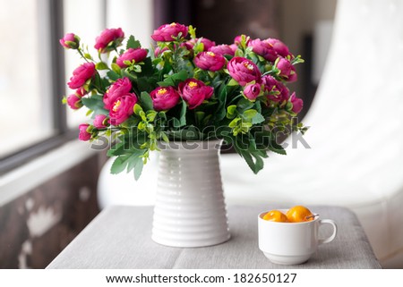 White vase, with red flowers