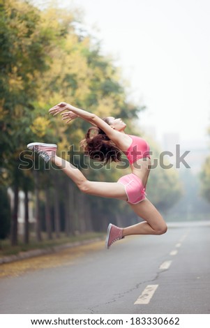 Asian girl, wearing a suit in gymnastics, outdoor exercise
