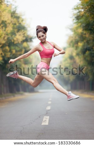 Asian girl, wearing a suit in gymnastics, outdoor exercise