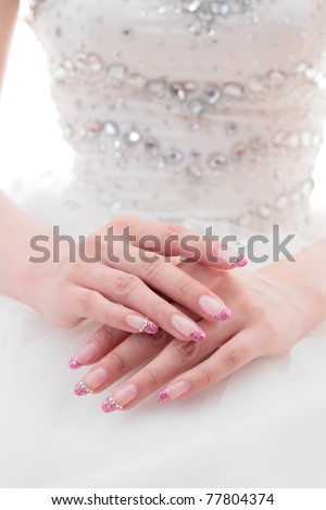 Asian bride, hands folded in her lap