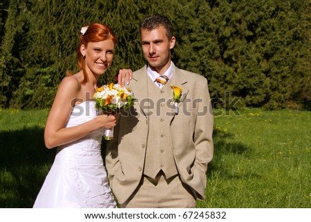 Young bride with flowers and his groom. You can write text on the right side.