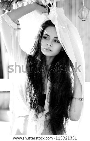 tender outdoor portrait of young attractive, tender, sensual and elegant woman