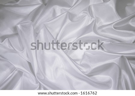 Luxurious white satin/silk folded fabric, useful for backgrounds