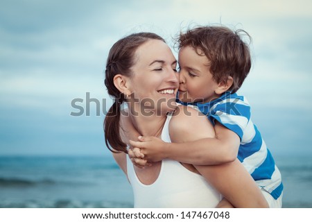 Portrait Of Happy Mother And Son At Sea, Outdoor