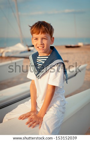 Portrait of young sailor near yacht, outdoor